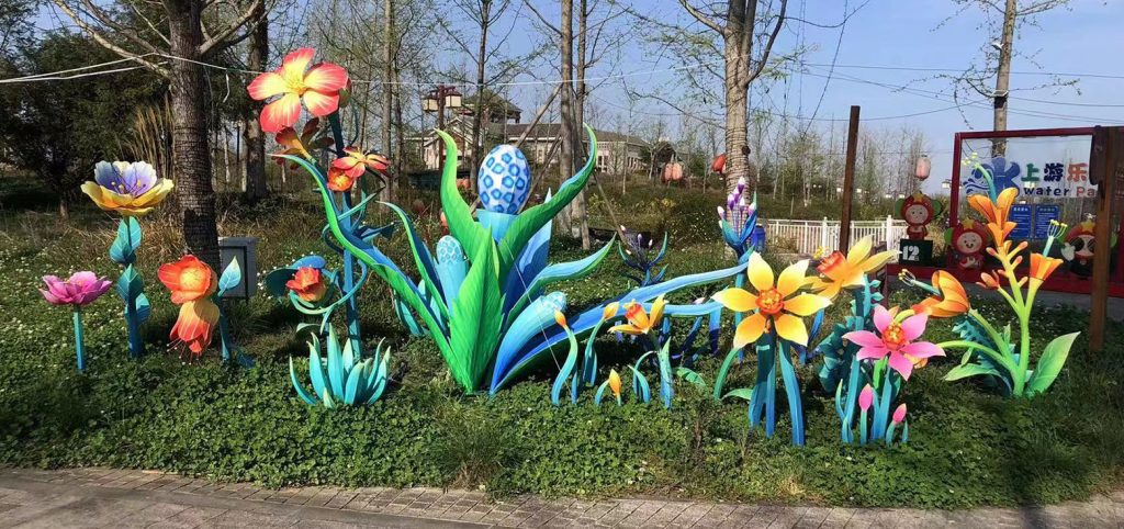 Plant and floral lanterns currently on display in an outdoor park.