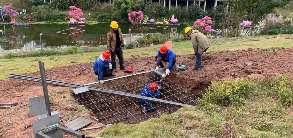 Workers are building the foundation for the installation of the Chinese lantern.