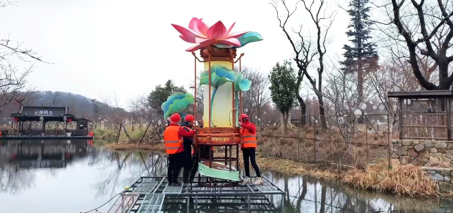 Scenic Water Area: Large Floating Lanterns Under Installation.