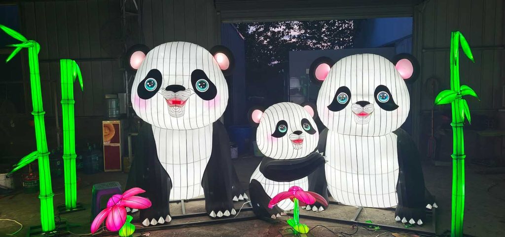 A set of adorable cartoon lanterns depicting a panda family.