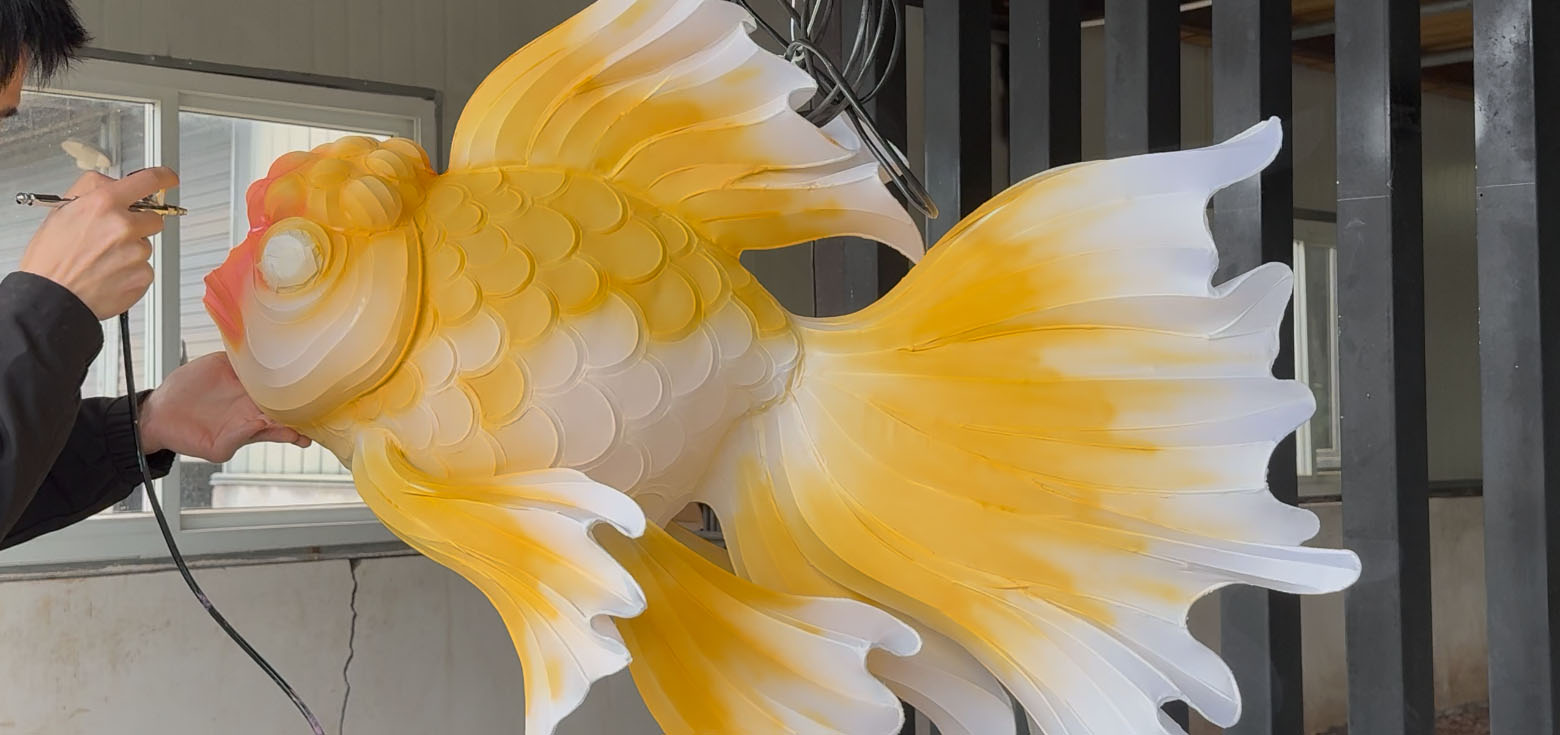 Chinese lantern craft: an artist spraying color onto a lantern.