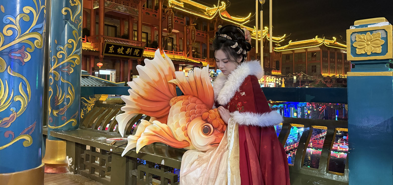 Traditional Chinese lanterns: a Hanfu-clad girl holding a goldfish lantern