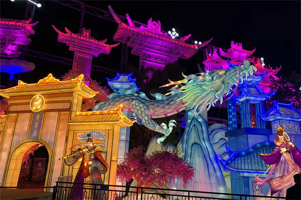 A custom-made festival lantern display: a Chinese dragon and pavilion buildings.