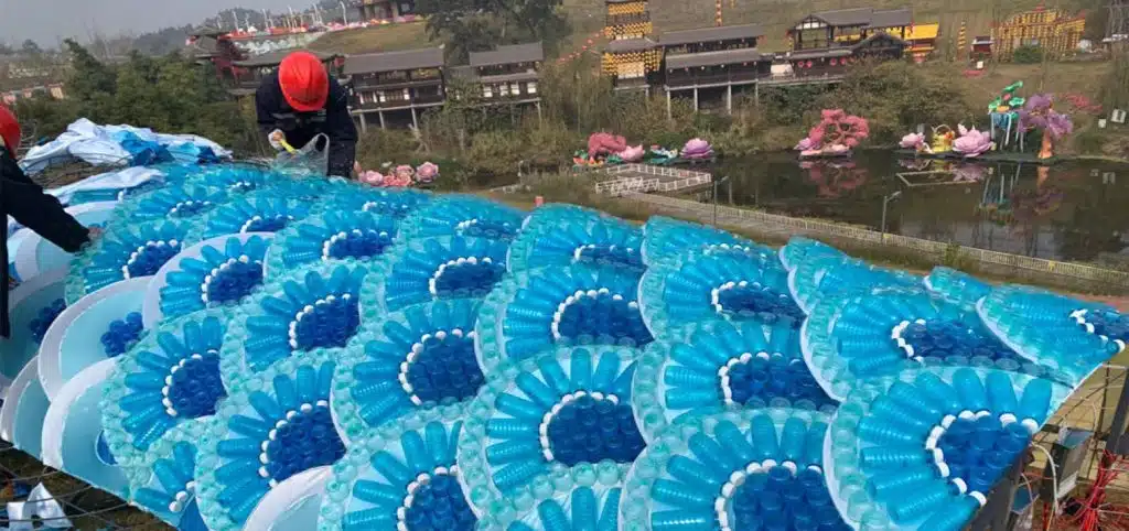 The workers are on-site, installing and debugging the structurally complex modern lanterns.