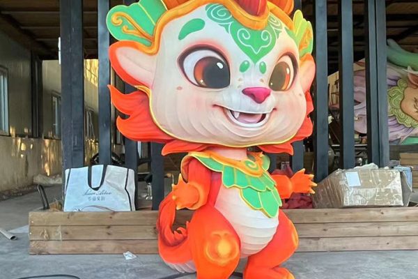 A brightly colored and adorably shaped cartoon dragon lantern.