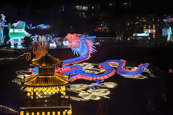 At night in the park, a hundred-meter-long giant Chinese Dragon Lantern is stunningly eye-catching.