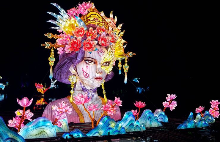 An exquisite, large outdoor lantern in the shape of a half-body human figure.