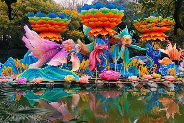 Giant Floating Lantern Displays: Colorful Fish and Lotus Lanterns.